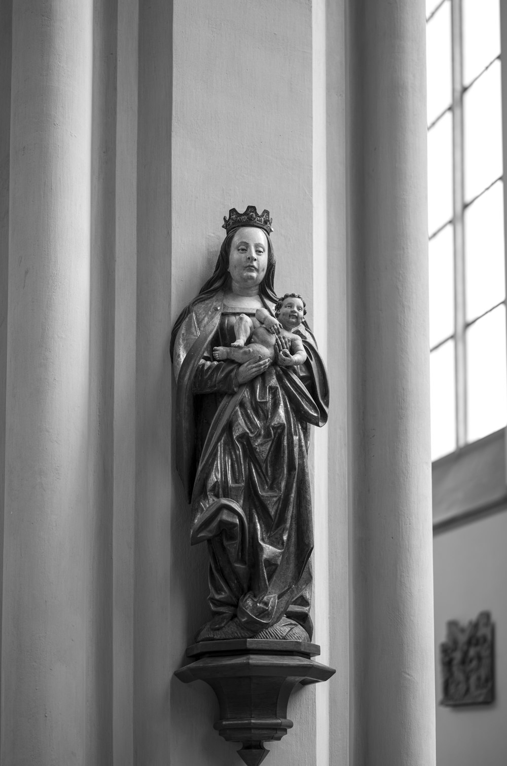 grayscale photo of woman statue