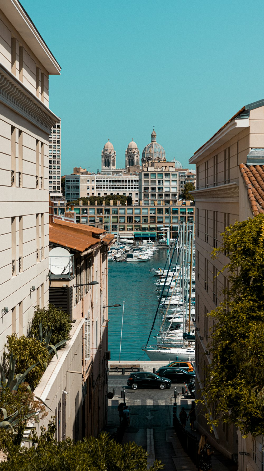 white and brown concrete building near body of water during daytime