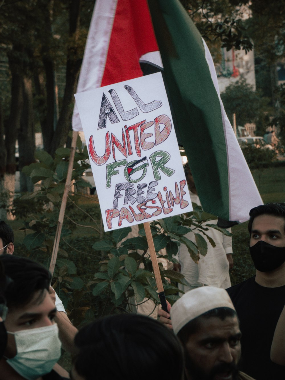 people holding flags during daytime