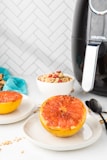 sliced orange fruit on white ceramic plate