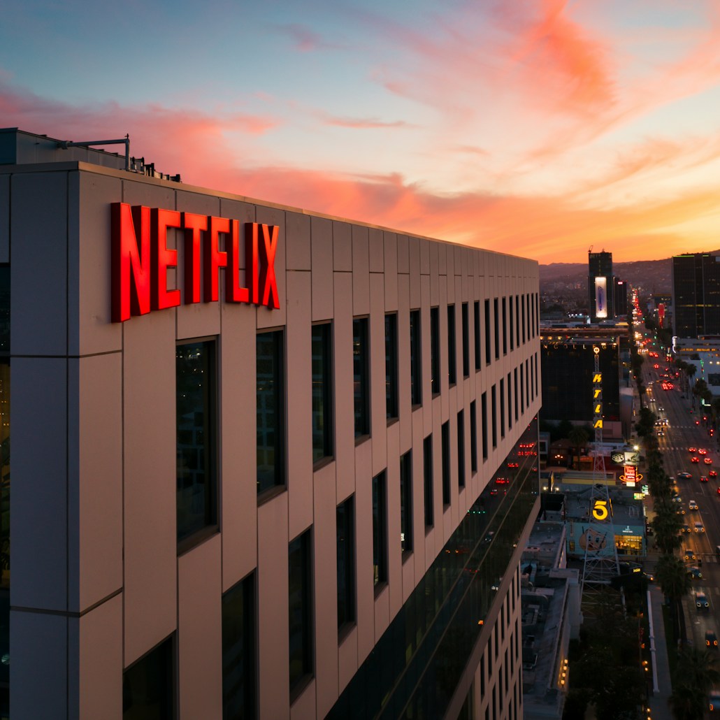 Netflix sign on a building at sunset. 