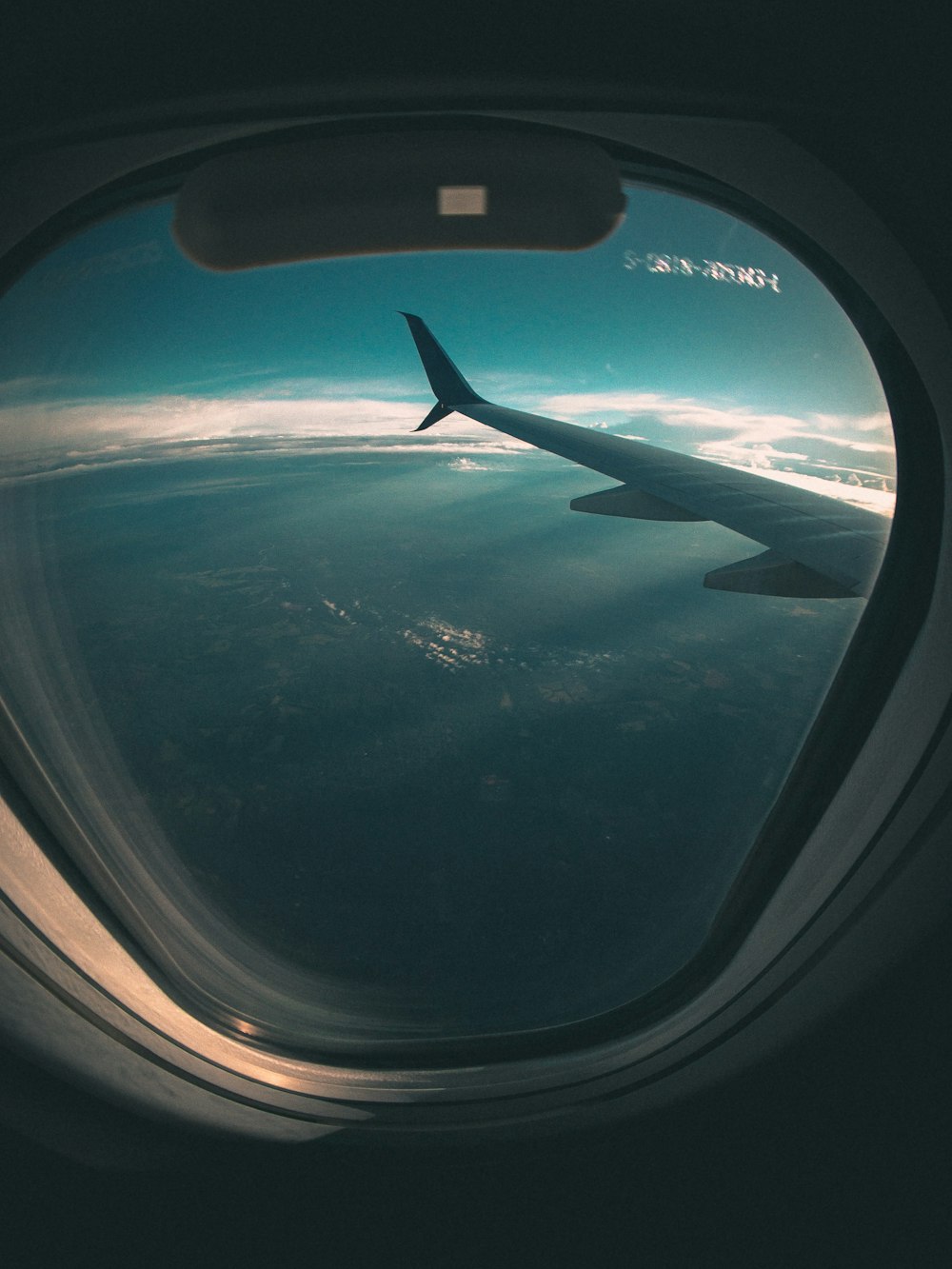 airplane window view of airplane wing