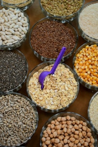 brown and white beans in clear glass containers