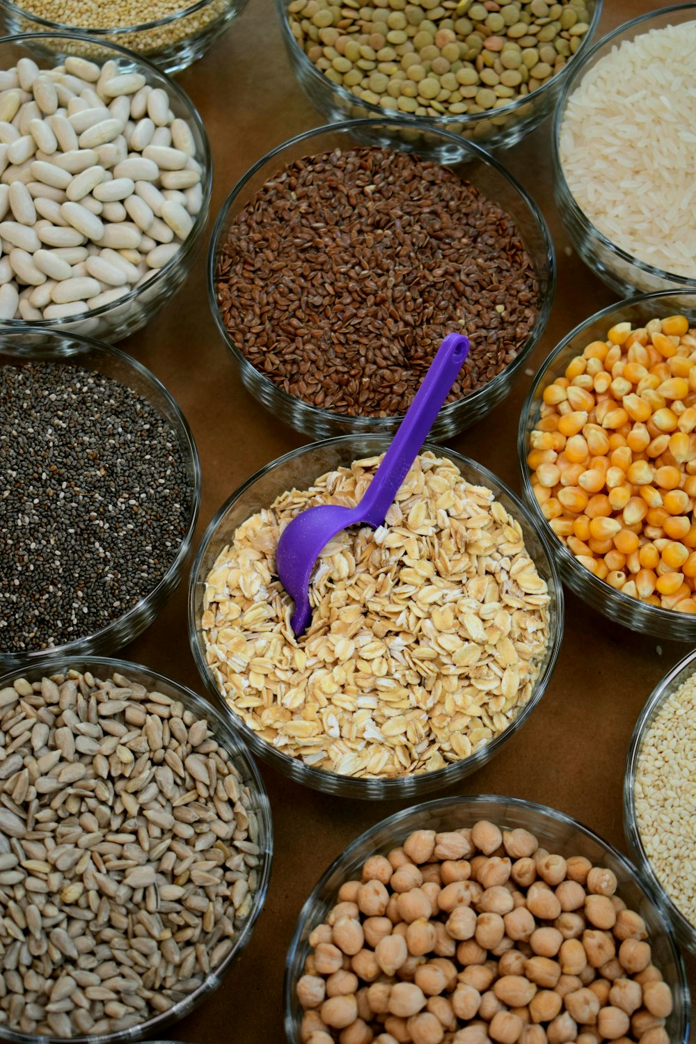 brown and white beans in clear glass containers