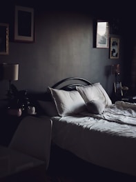 Peaceful bedroom with soft lighting and comfortable bedding.