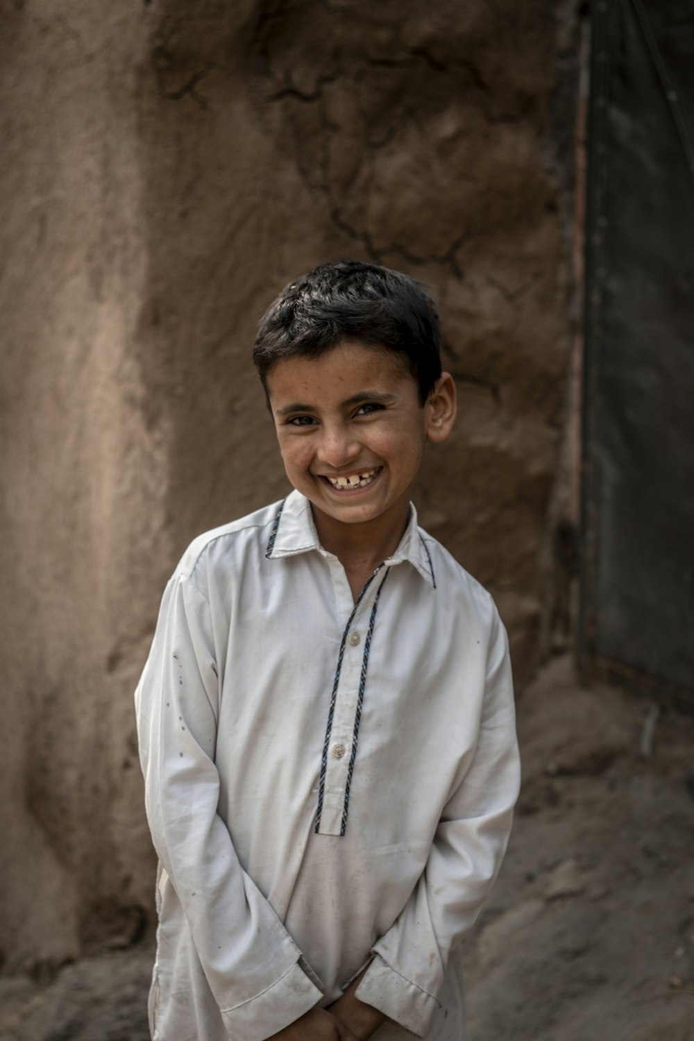 man in white dress shirt smiling