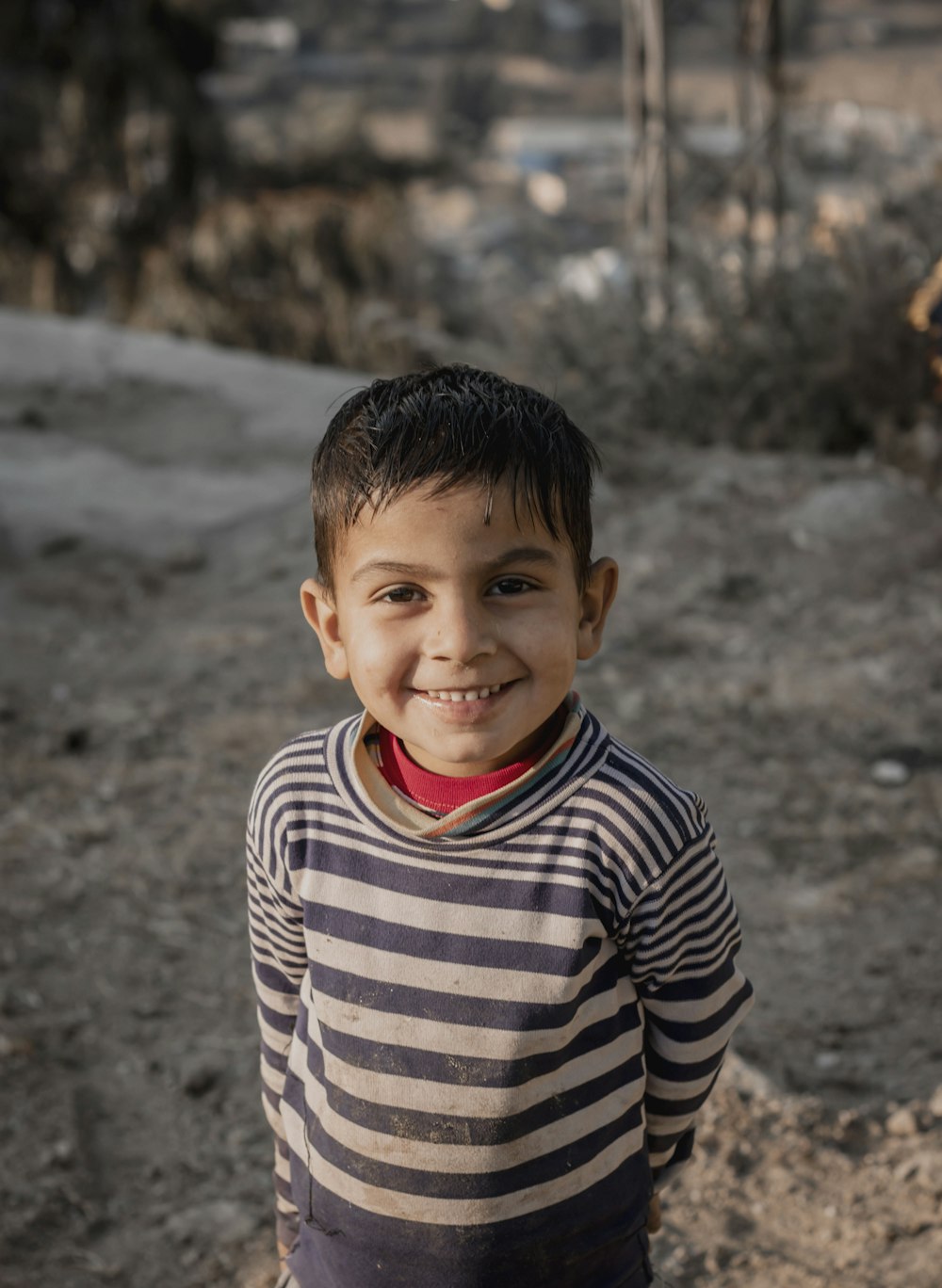 boy in black and white striped long sleeve shirt