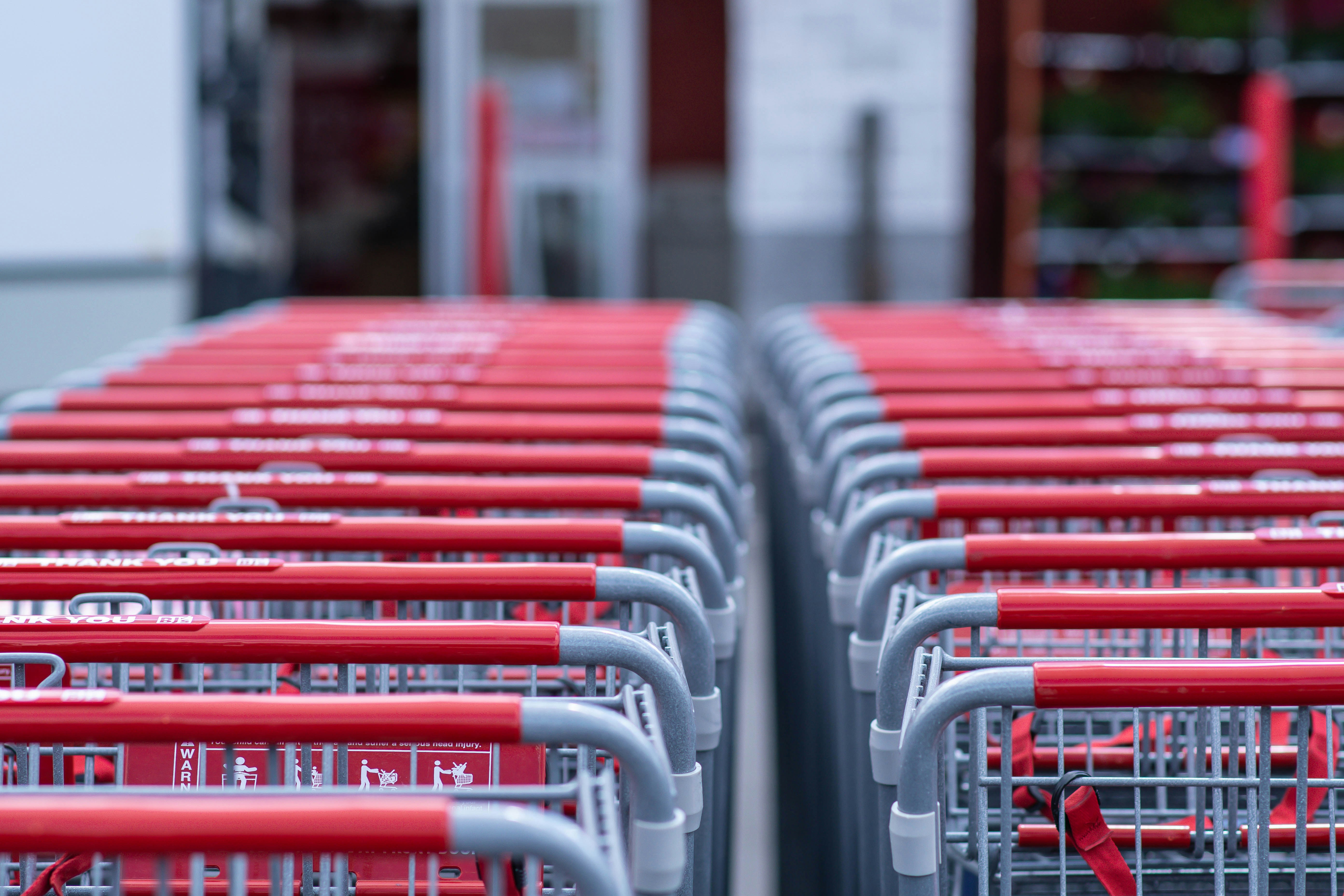 Abstract graphic representing AI in retail with data streams and shopping carts