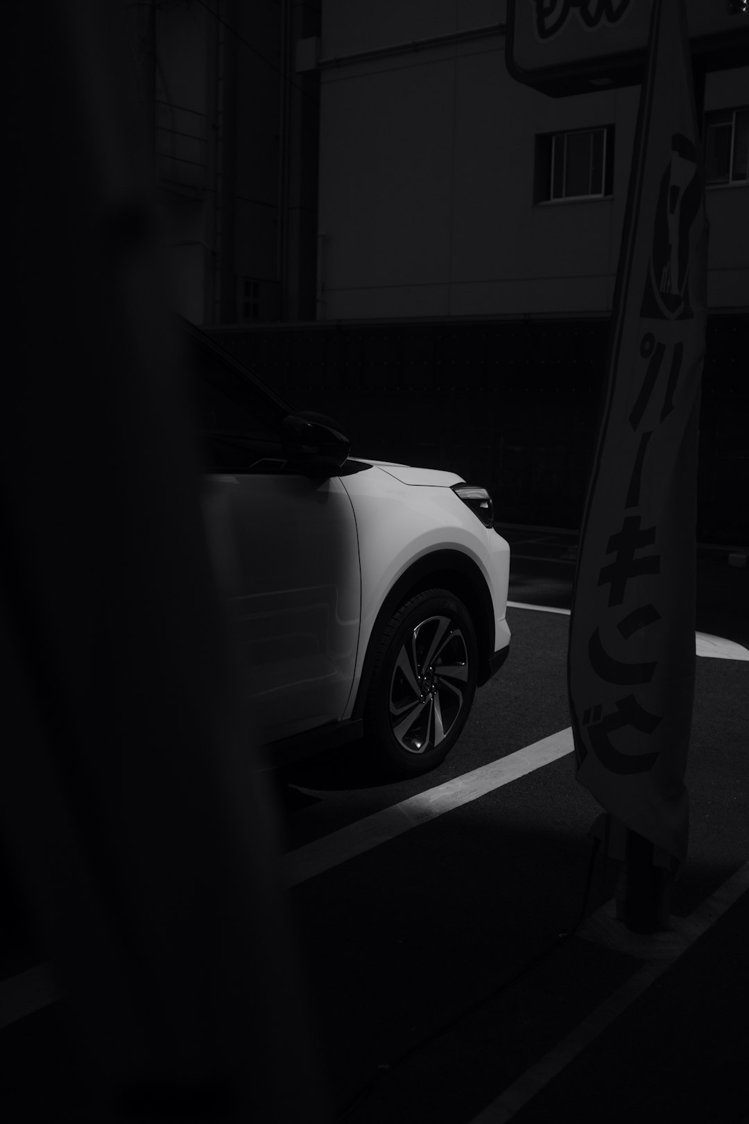 white car in a dark room
