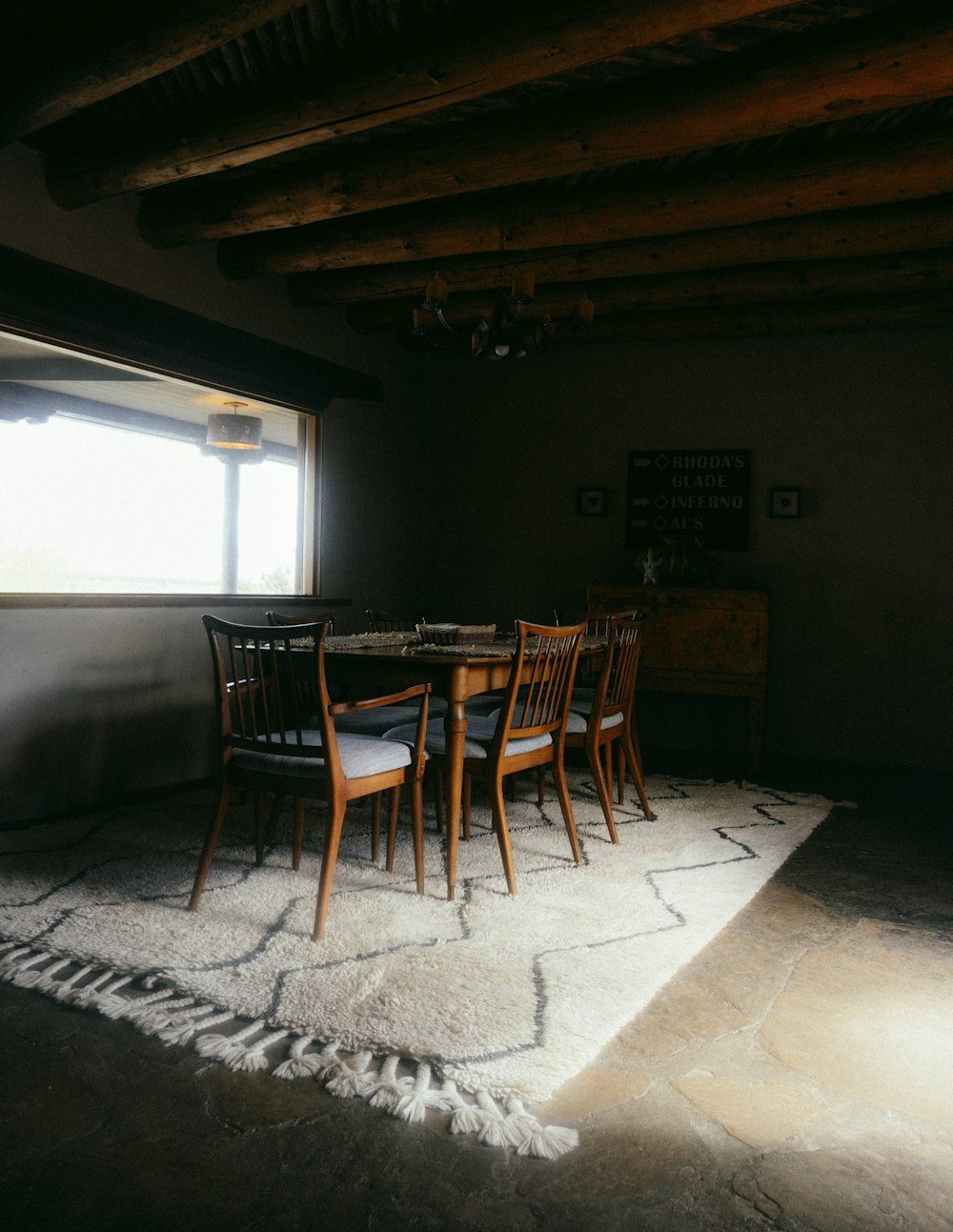 brown wooden table and chairs