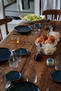 An inviting dining table set for a family meal with various ready-to-eat dishes from Saborlar