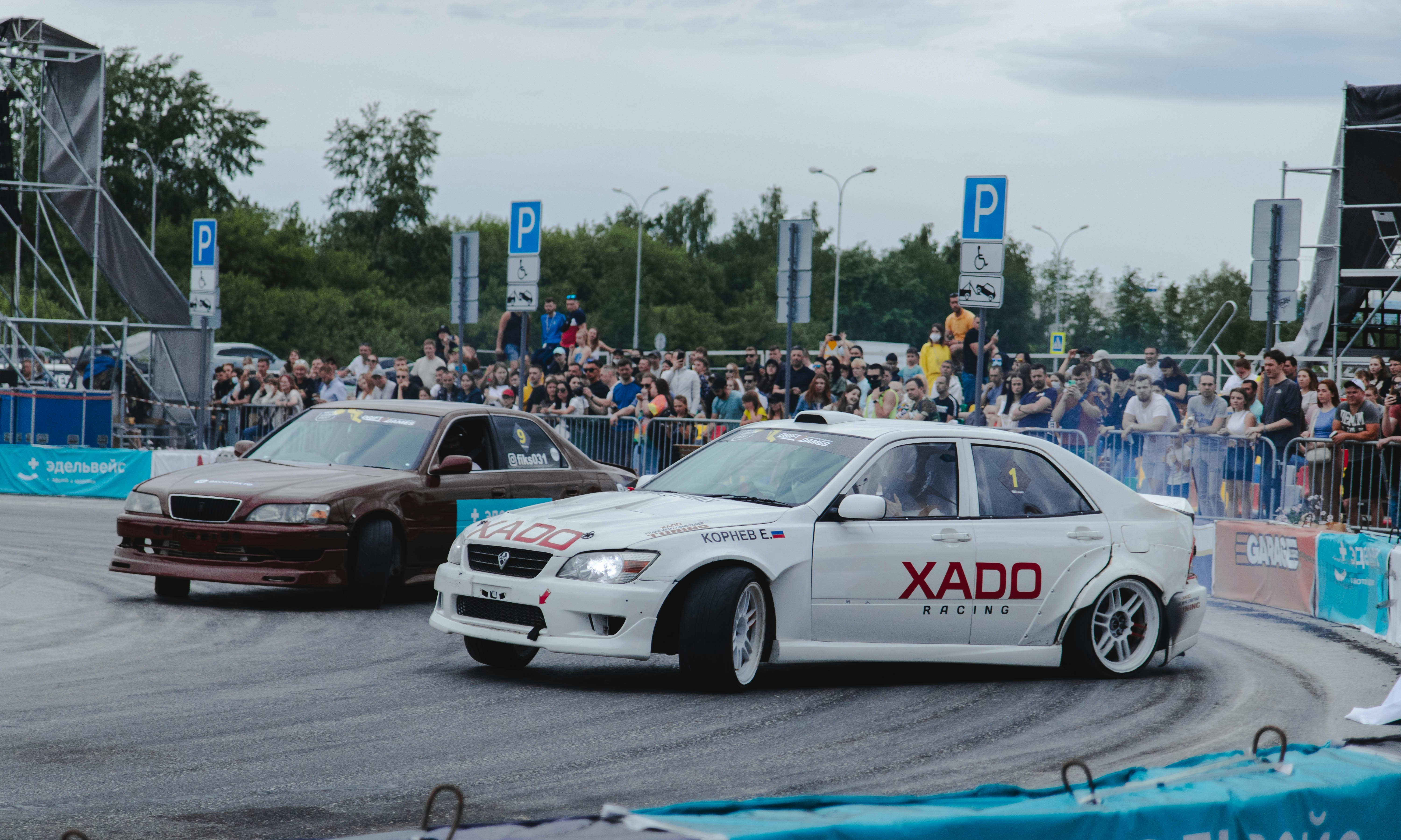 white and red bmw m 3 on road during daytime
