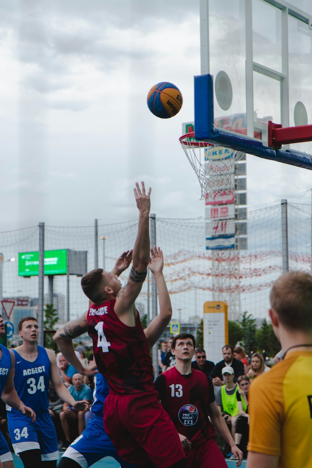 man in black tank top playing basketball