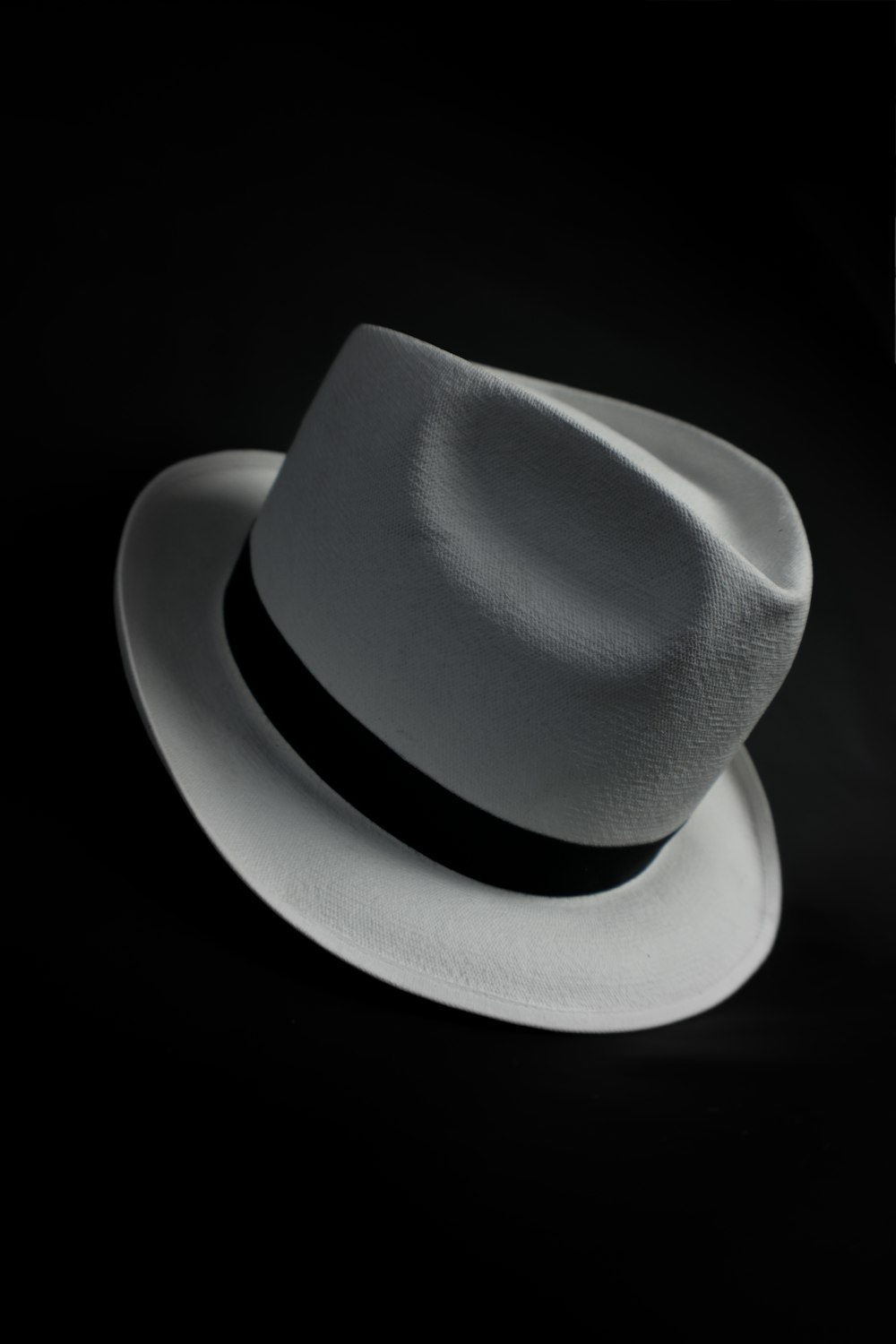 white cowboy hat on black background