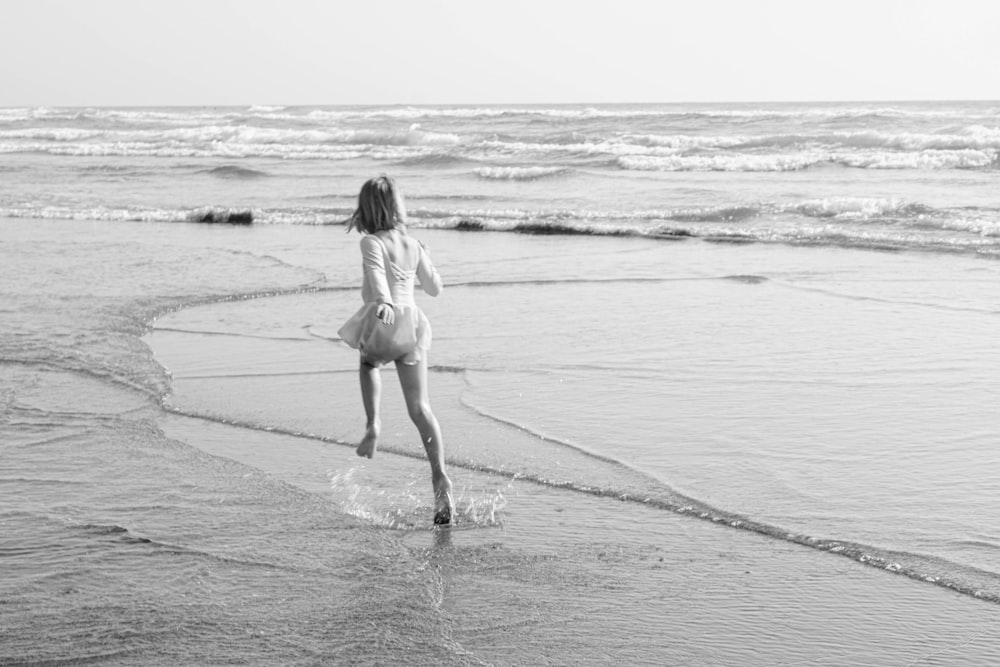 woman in bikini walking on beach
