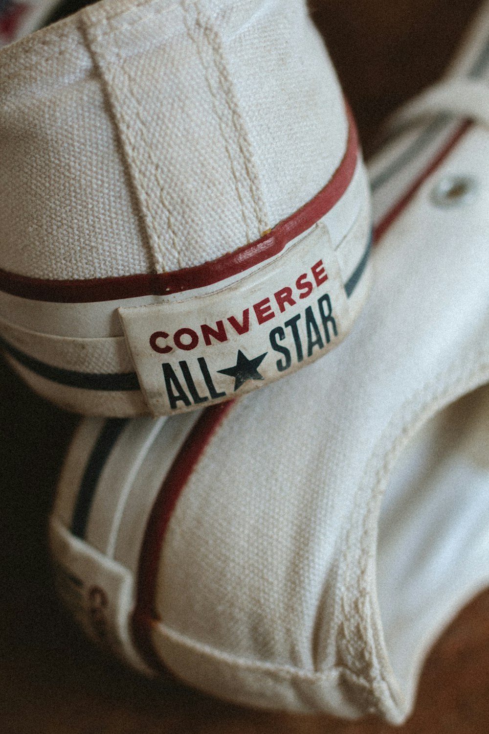 a pair of converse all star shoes on top of each other