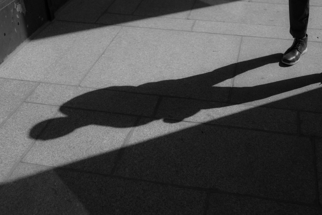 shadow of person on gray concrete floor