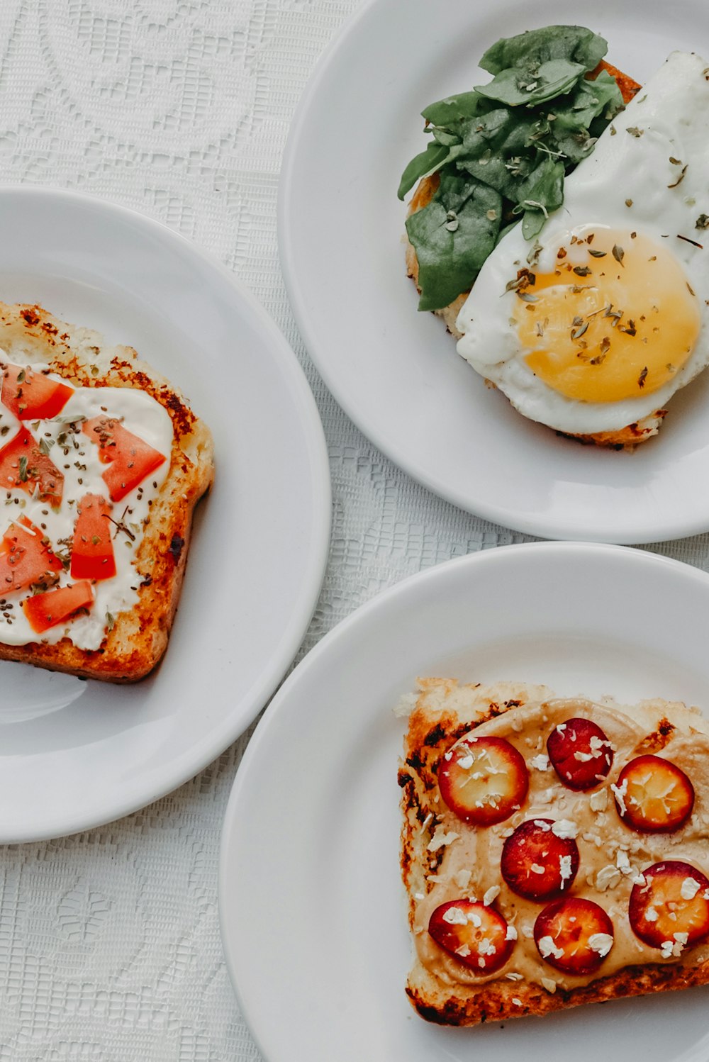 egg with tomato and green vegetable on white ceramic plate