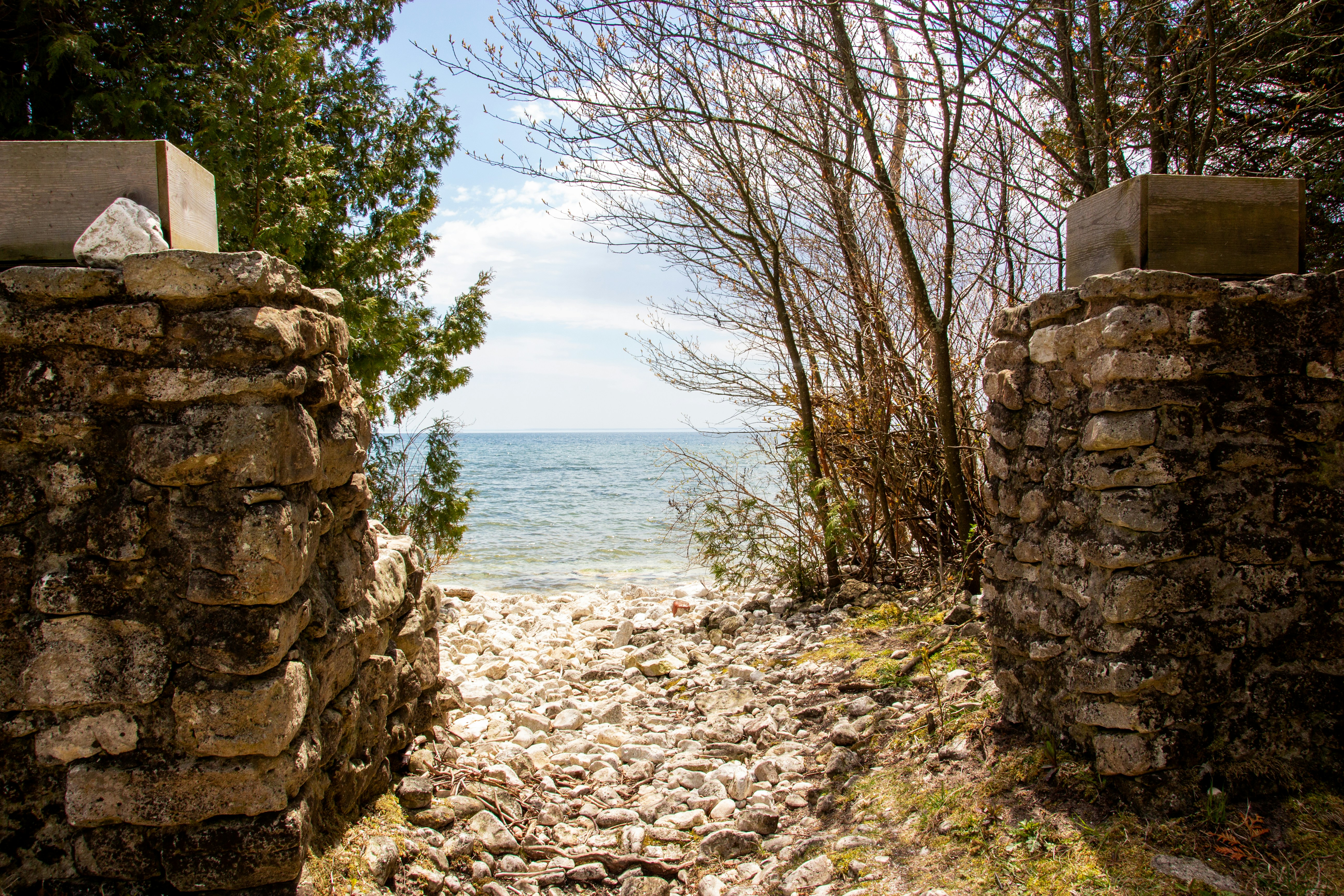 brown concrete wall near body of water during daytime