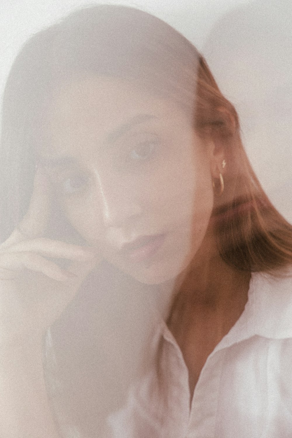 woman in white collared shirt wearing eyeglasses