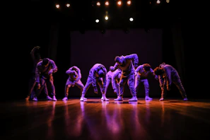 Advanced students performing a synchronized routine on a polished wooden floor.