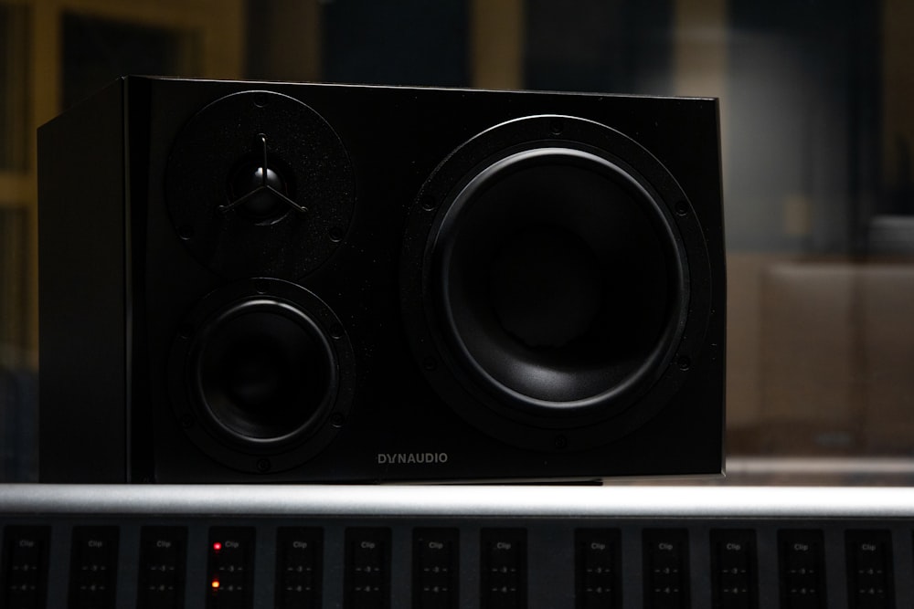 black and white speakers on white computer keyboard