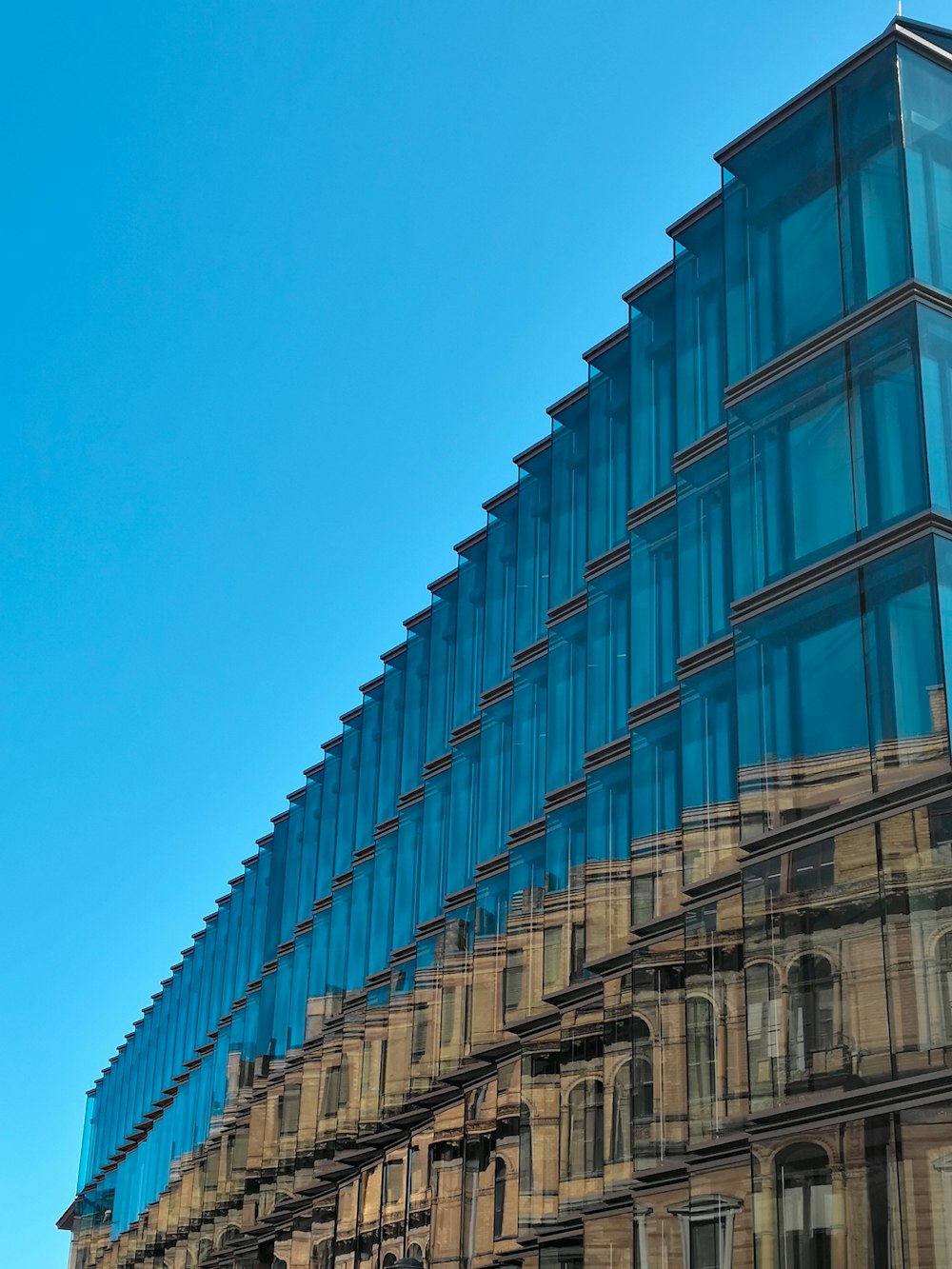 brown concrete building under blue sky during daytime