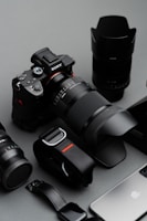 black nikon dslr camera on white table