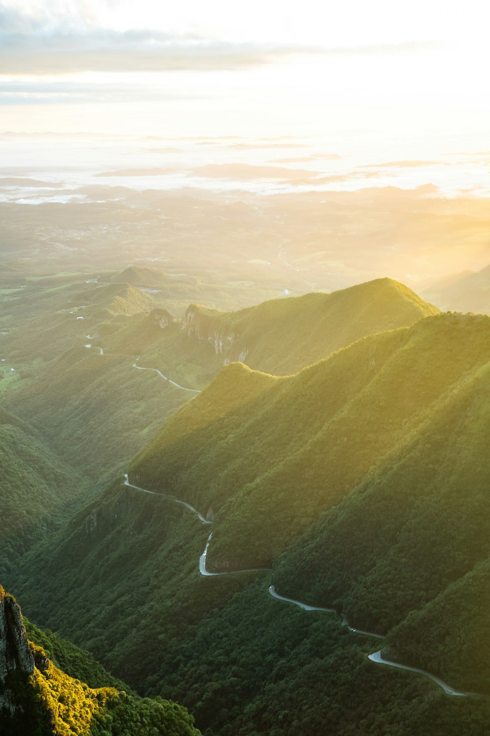 green mountains under white clouds during daytime