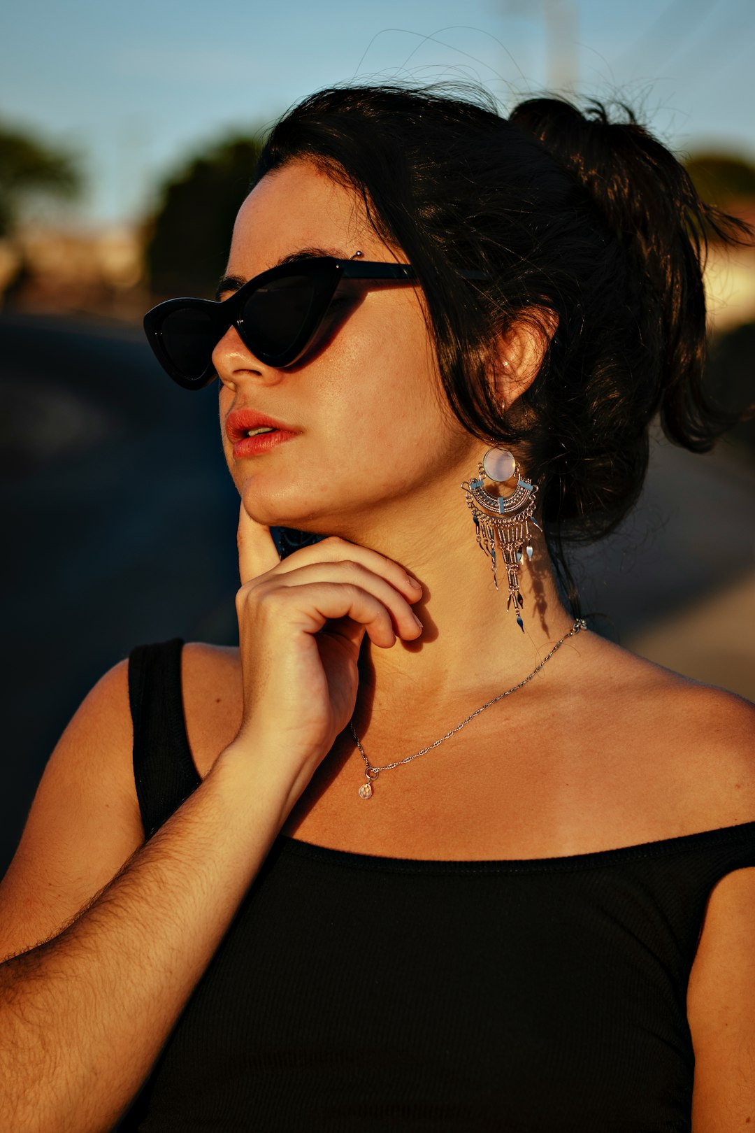 woman in black tank top wearing black sunglasses