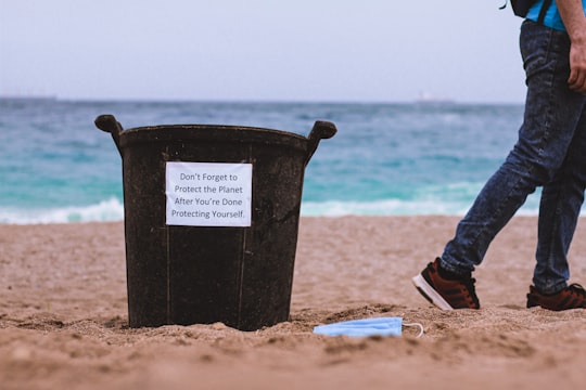black plastic bucket on brown sand near body of water during daytime in Alger Algeria
