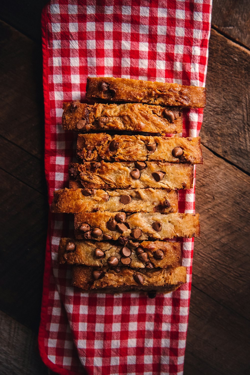 brown bread on red and white plaid textile