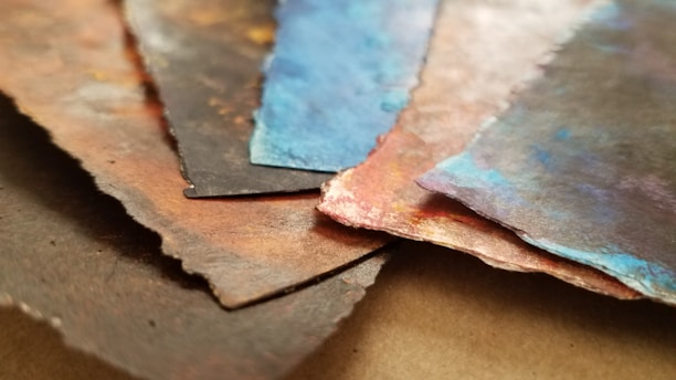 Close-up of the layered paper work in the 3D woodpecker art piece.