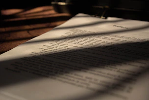 white book page on brown wooden table