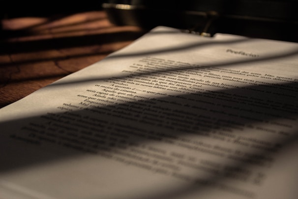 white book page on brown wooden table