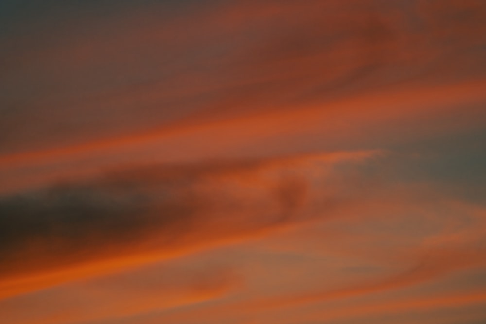 orange and blue cloudy sky during sunset