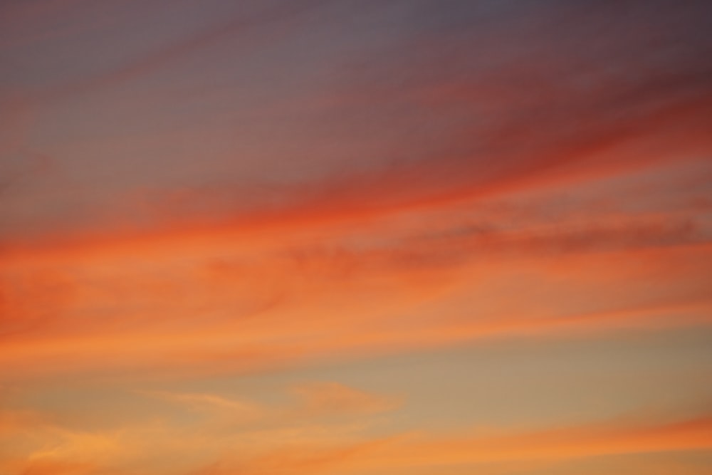 orange and blue cloudy sky during sunset