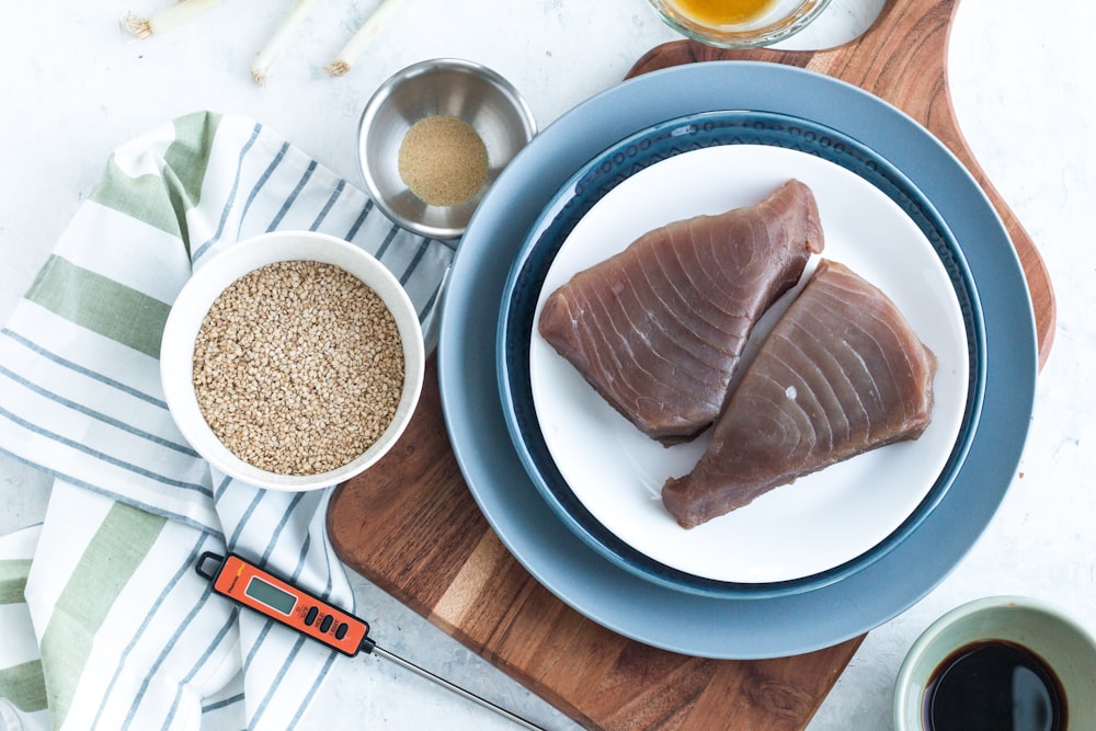 sliced meat on white and blue ceramic plate