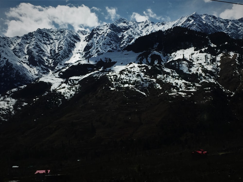 snow covered mountain during daytime