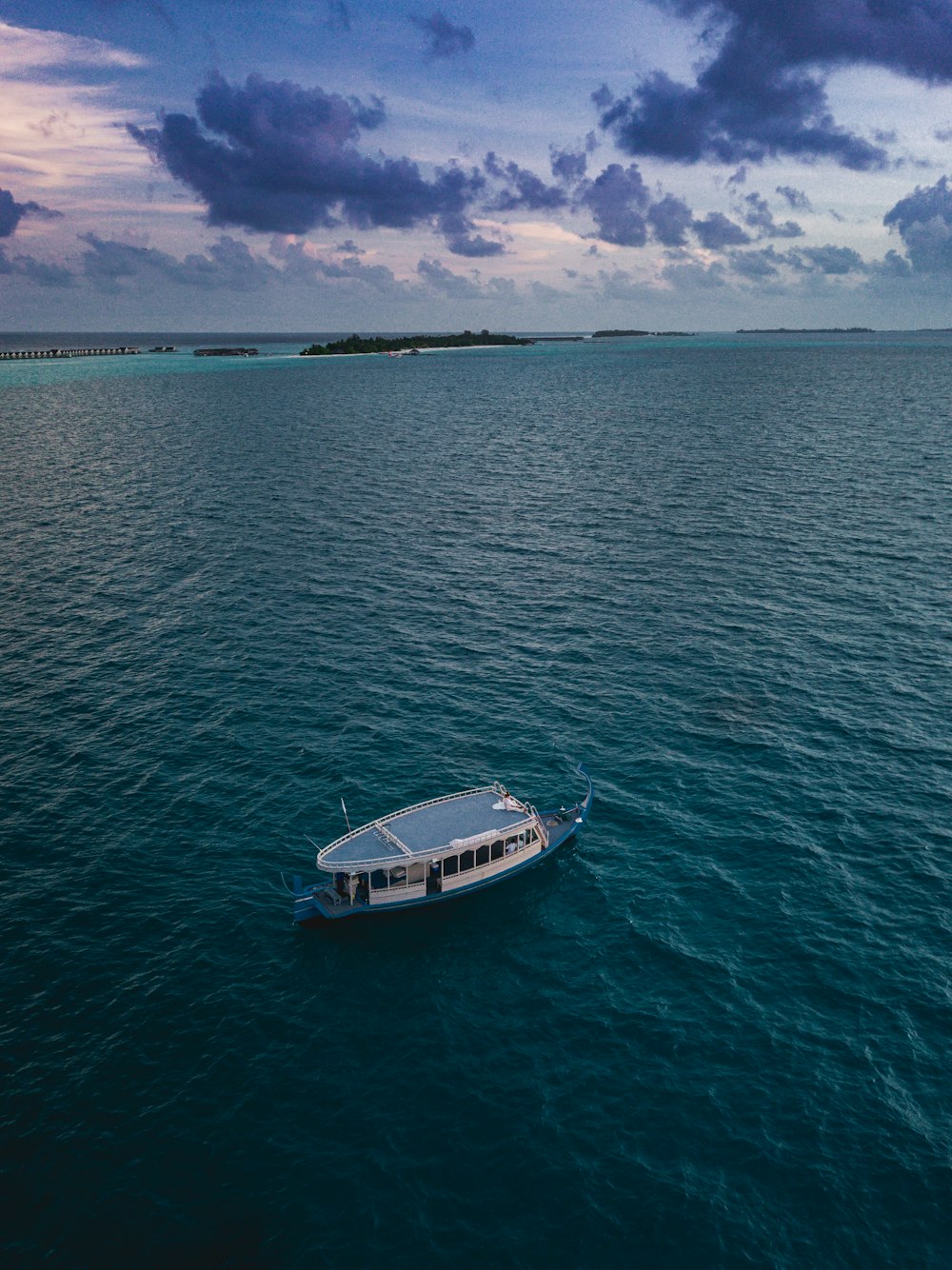 white and black boat on sea during daytime