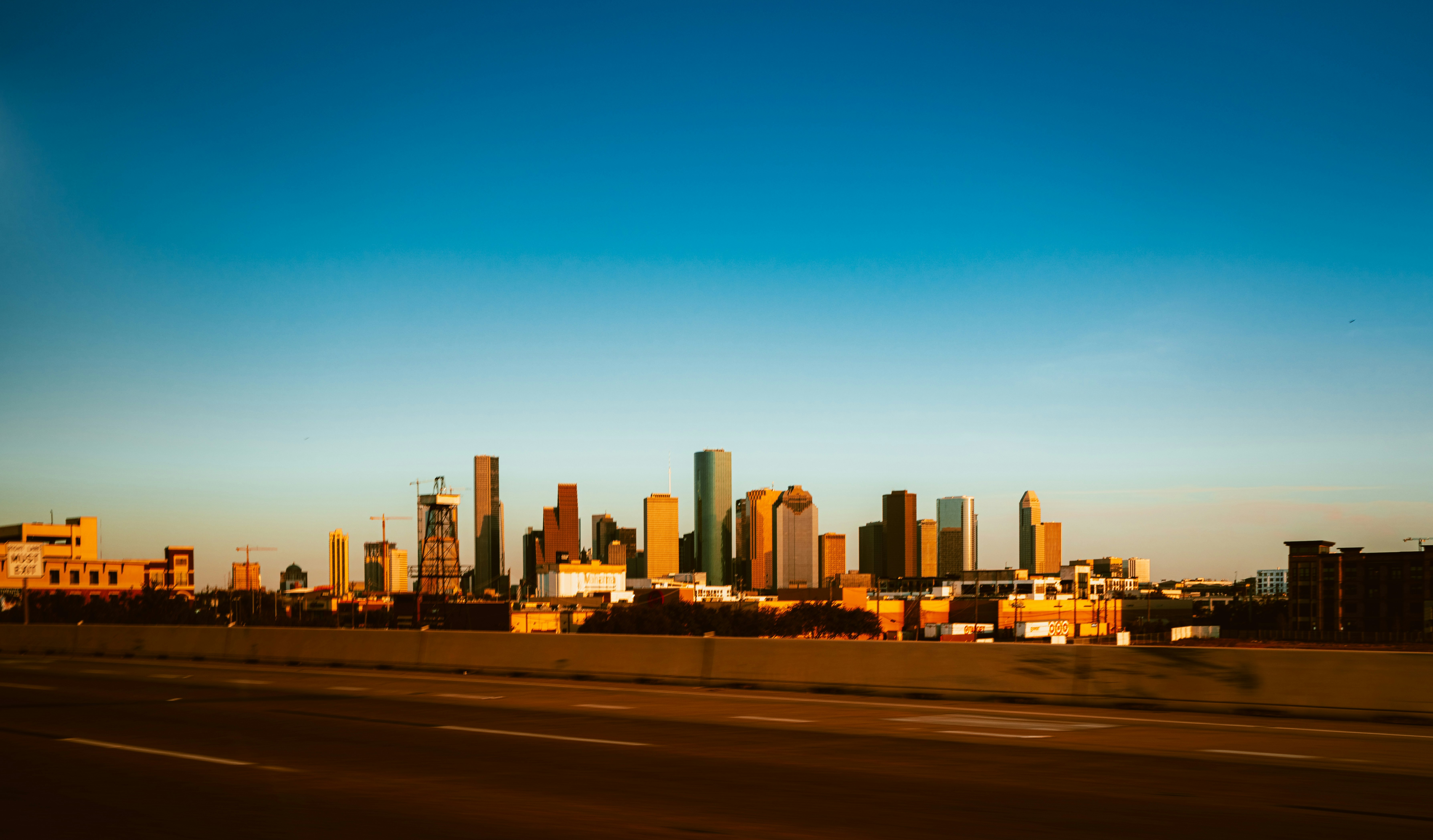 city skyline under blue sky during daytime