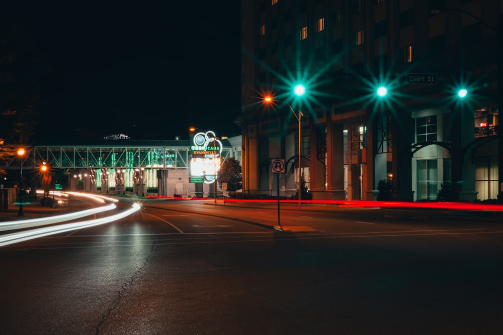 city street with lights turned on during night time