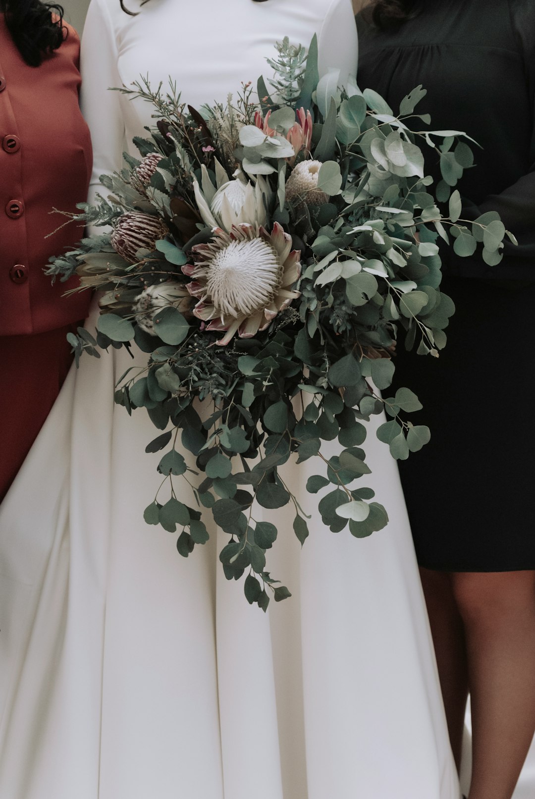 white flower bouquet on white textile