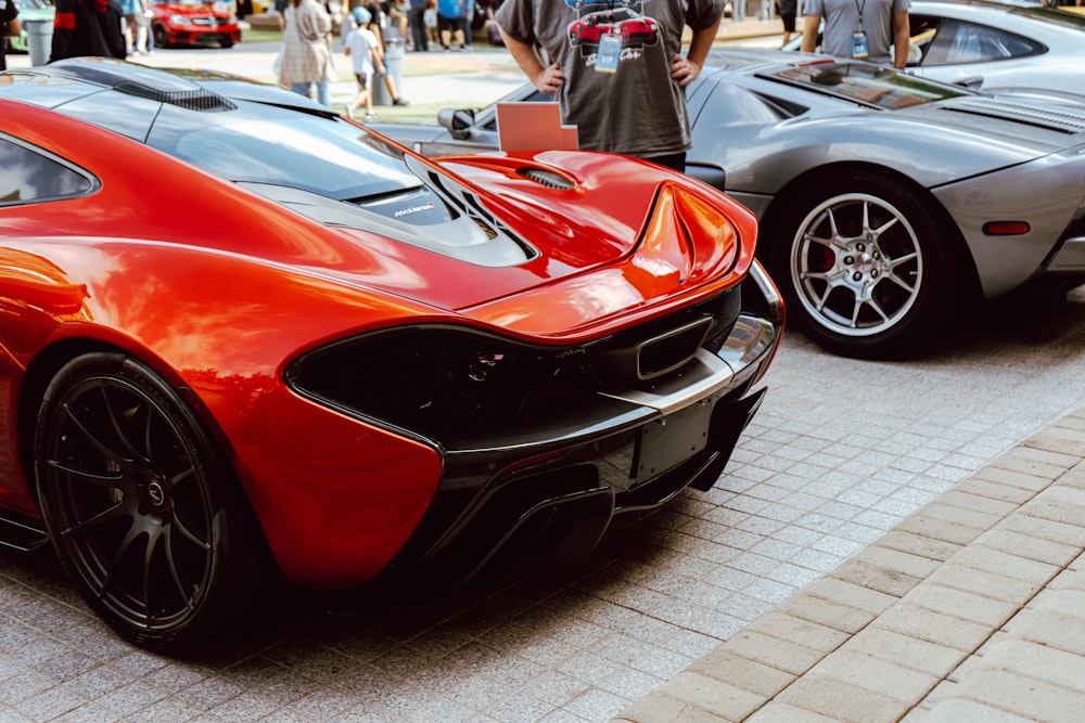 red ferrari car on white tiled floor