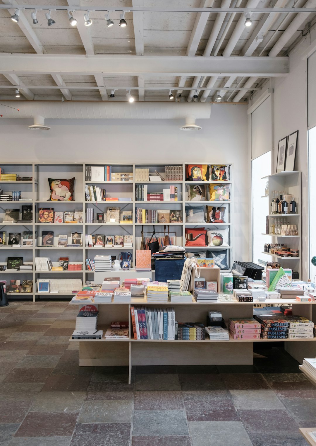 books on white wooden shelf