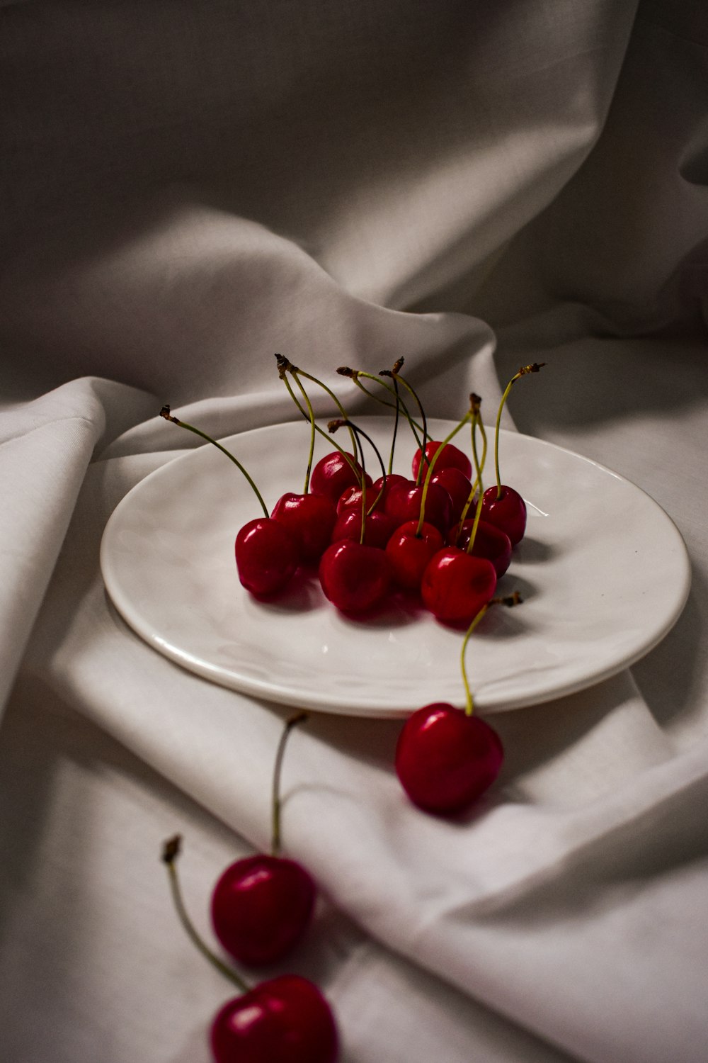 red cherries on white ceramic plate, The health benefits of cherries, learn more from NWP, non political news source, health and wellness no bias news, food