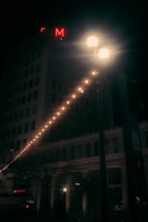 Photo of a large, illuminated building sign mounted high on a commercial property.