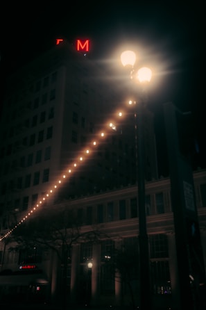 Photo of a large, illuminated building sign mounted high on a commercial property.