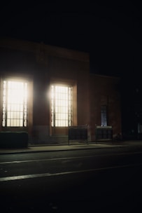LED window display system brightly illuminating a shopfront at dusk.