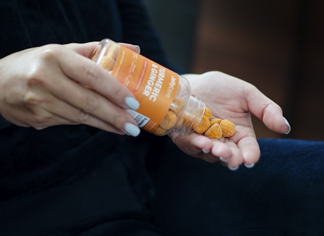 orange and white plastic bottle